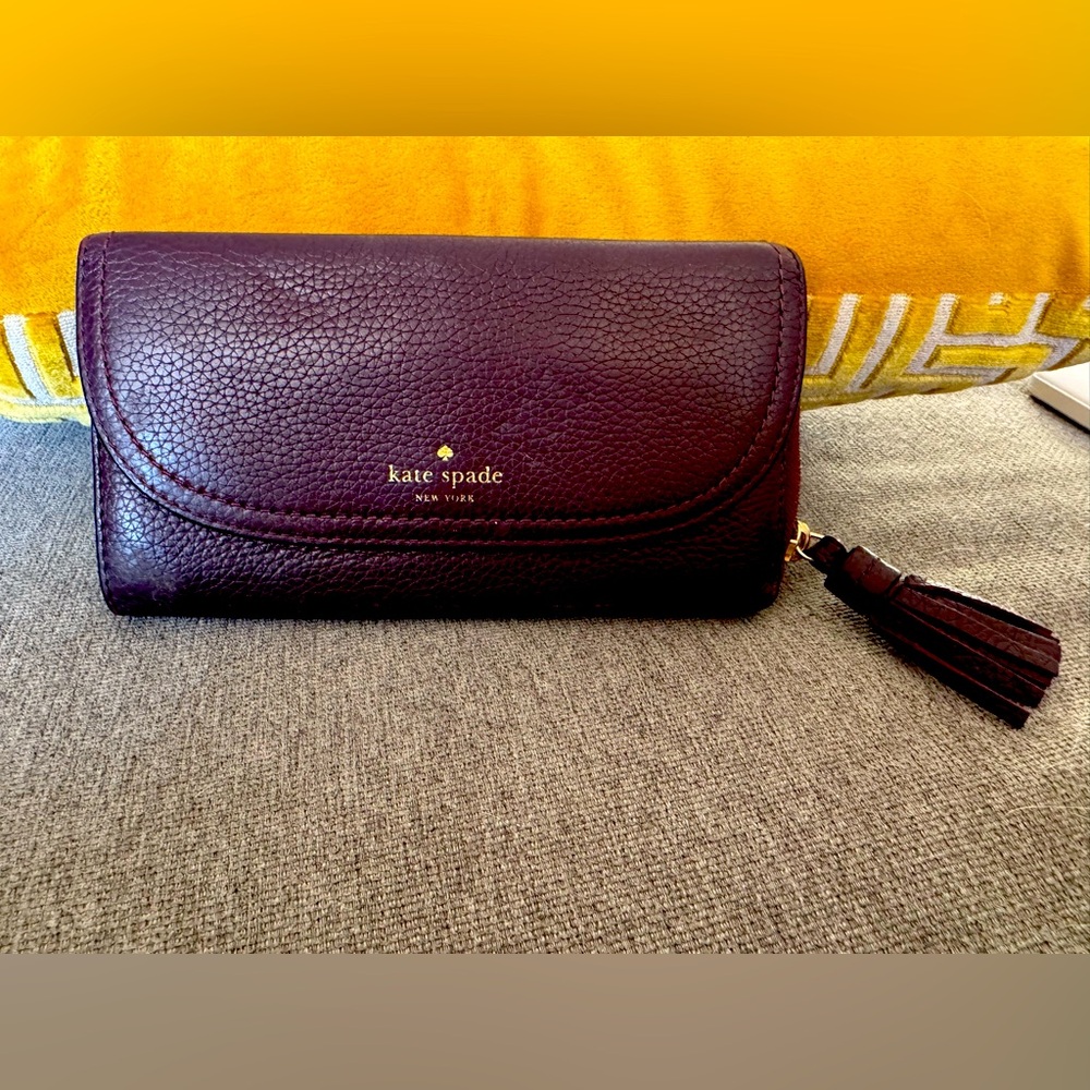 Gorgeous leather maroon Kate Spade Wallet with tassel